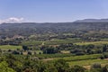 Panoramic view ofÃÂ Little Luberon valley from hilltop, vineyards, orchards, cultivated fields, deciduous treesin the summer